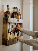 Load image into Gallery viewer, Dark walnut bourbon whiskey liquor barrel stave shelf, wood bottle display cabinet, wall mount, easy installation, staged with bourbon bottles
