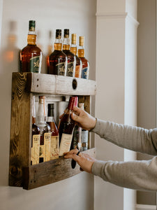 Dark walnut bourbon whiskey liquor barrel stave shelf, wood bottle display cabinet, wall mount, easy installation, staged with bourbon bottles